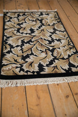 Side angle view showing the rug's plush, carved pile and clean, intact side cord selvage.