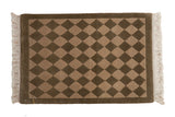 Vintage Indian rug mat, olive green and beige checkered diamonds with carved contour.