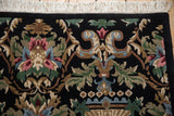 Modern Savonnerie design showing blush, blue, green Rococo scrolls and crisp fringe.