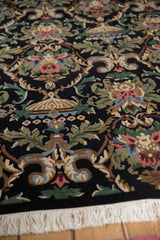 Rococo stylized floral motifs in blush, blue, green, and beige, with white fringe.