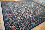 Full perspective view of a Savonnerie design carpet with a floral lattice and wide, intricate borders.