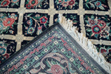 Fine hand-knotted construction and secure selvage visible on the folded corner of a vintage Pakistani carpet.