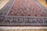 Traditional navy floral border with cherry red field and crisp ivory fringe.