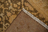 Corner view showing the hand-knotted back, intact side cord, and plush gold pile.