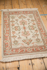Vintage Indian Mahal rug detail: ivory field with terracotta, sea foam floral palmettes and buds.
