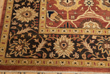 Corner detail of the Mahal carpet's wide palmette border in dark chocolate brown and gold.