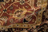 A soft fold in a Mahal carpet highlights its dense pile and palmette designs in copper and gold.