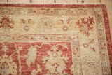 Hand knotted Peshawar rug corner detail with intact side cord selvage and pale cherry red, ivory floral motifs.