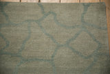 Abstract Indian carpet's dusty celadon and ocean green abrashed ground with fieldstone pattern.