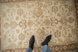 Vintage Mahal rug's cream field with copper floral vines and delicate border.