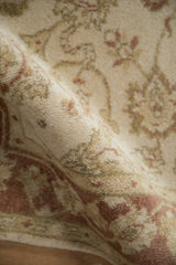 Rich, even pile of the Indian Mahal rug with cream and copper scrolling floral vines.