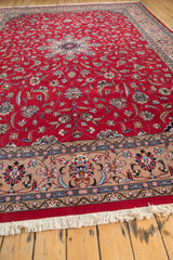 Intact cream fringe with a beige border showcasing delicate palmette and vinery patterns.