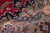 Vintage Pakistani Isfahan carpet with delicate vinery and lotus patterns in sand, slate blue, and cherry red.