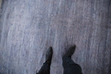 Modern abstract carpet with faded royal and denim blue horizontal striations and faux silk pile.