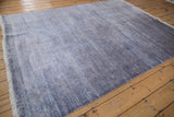 Faux silk pile texture with dusty blue and denim blue abrashes, showing fringe.