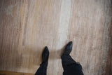 Striated modern abstract rug pile with ivory, sand, and copper faux silk blend.