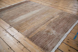 Fringe and faux silk pile texture with variegated sand, copper, silver tones on an Indian Modern Abstract rug.