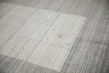 Contemporary Indian Gabbeh rug, displaying geometric paneled motifs and abrash in silver tones.