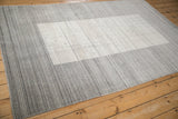Striated silver and platinum pile of the Indian Gabbeh carpet with intact selvage.
