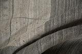 Contemporary Indian Gabbeh carpet close-up, showing textured pile, silver abrashes, and paneled design.