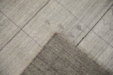 Hand-loomed backing and silver-toned pile with subtle Gabbeh pattern details and abrashes.