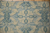 Raised ivory quatrefoil motifs contrast with low-profile powder blue Soumac weave.