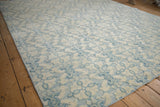 Textured ivory and powder blue floral quatrefoil pattern with abrash on the Indian Soumac carpet.