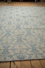 Three-dimensional ivory and powder blue floral lattice on a contemporary Indian Soumac carpet.