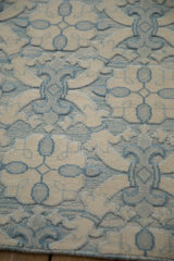 Ivory and powder blue floral quatrefoil pattern, highlighting Soumac's three-dimensional cut pile.