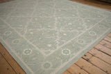 Hand woven Indian Soumac carpet with sage green trellis vinery and Herati-inspired border.