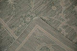 Hand woven Indian Soumac carpet: sage green pattern, tightly woven reverse, and intact side selvage.