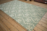 Pale green and ivory roundel medallions, showing the Soumac's unique dimensional woven pattern.