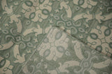 Indian Soumac carpet folded, contrasting piled face, distinct reverse weave, ivory, green.