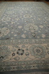 Slate blue Indian Mahal carpet with curvilinear floral field and repeating boteh border.