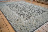 Distressed Agra carpet border with ecru, platinum, dark silver curvilinear floral motifs.