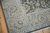 Distressed Agra carpet corner with pale ecru, silver palmette motifs, original selvage.
