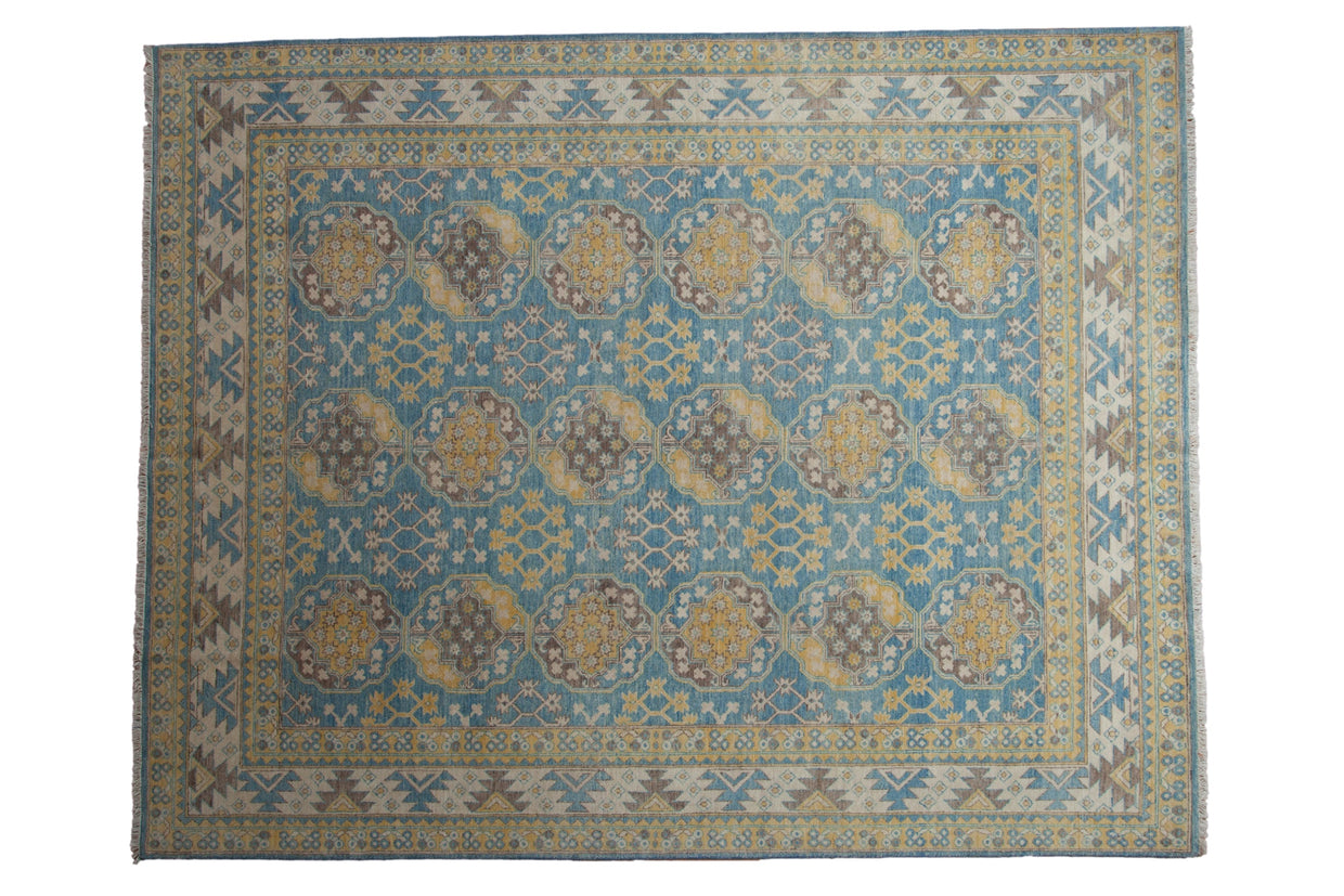 Pakistani Ersari carpet featuring vivid blue, yellow, coffee brown repeating gul motifs, 7'10