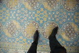 Ersari rug with vivid blue, yellow, ivory, and brown gul and starburst motifs.