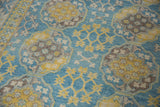 Pakistani Ersari rug displaying yellow starburst floral motifs and blue snowflake guls.