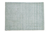 Abstract Indian rug mat with luminous sea foam green blue and ivory platinum striations.