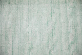 High luster soft pile with sea foam green-blue and ivory platinum abstract striations.