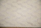 Contemporary Indian carpet with raised lustrous ivory serpent motifs on looped pile.