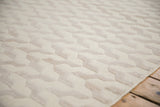 Lustrous raised cup pile showing alternating serpent pattern on an ivory and beige contemporary Indian rug.