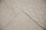 Ivory Contemporary carpet corner, showing raised cup pile, distinct looped texture, and hand knotted back.