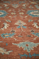 Detailed texture of a hand-knotted Indian Mahal rug with turquoise and ivory floral designs.