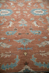 Detailed view of the Mahal carpet's short pile, showing turquoise and ivory floral motifs.