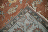 Folded corner of a Mahal carpet showing the hand-knotted back and copper-colored floral pile.