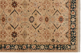 Serrated leaf arabesques and palmettes on a vintage carpet's ivory field and deep teal border.