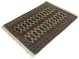 Angled view of a vintage Siberian Bokhara rug showcasing its full pile and geometric gul pattern.