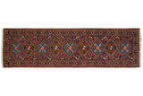 Vintage Ardebil rug runner with a geometric design of alternating diamond medallions in rust red, sapphire blue, and gold.